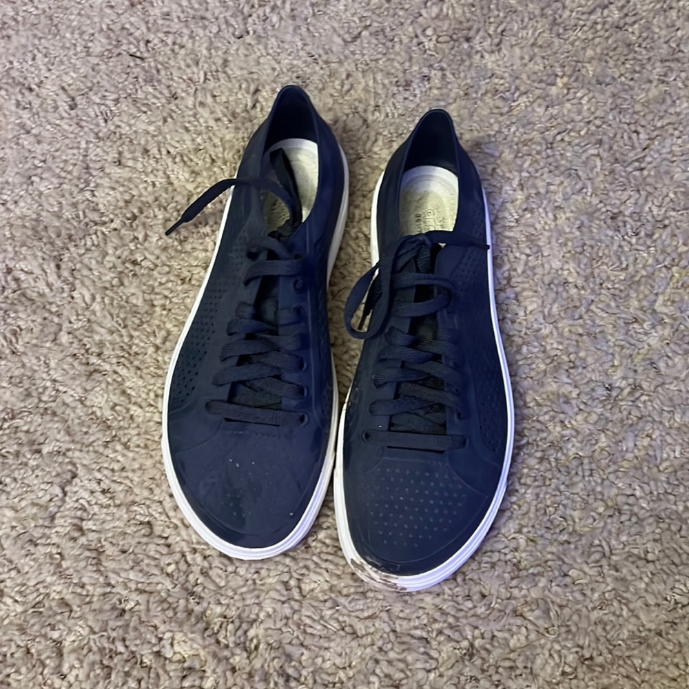 croc shoes. Condition: worn.